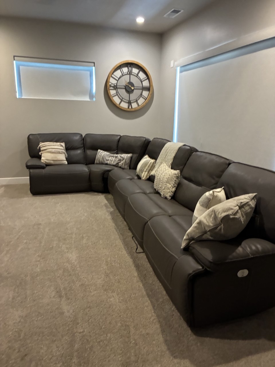 Clean living room with sectional couch and fresh carpet
