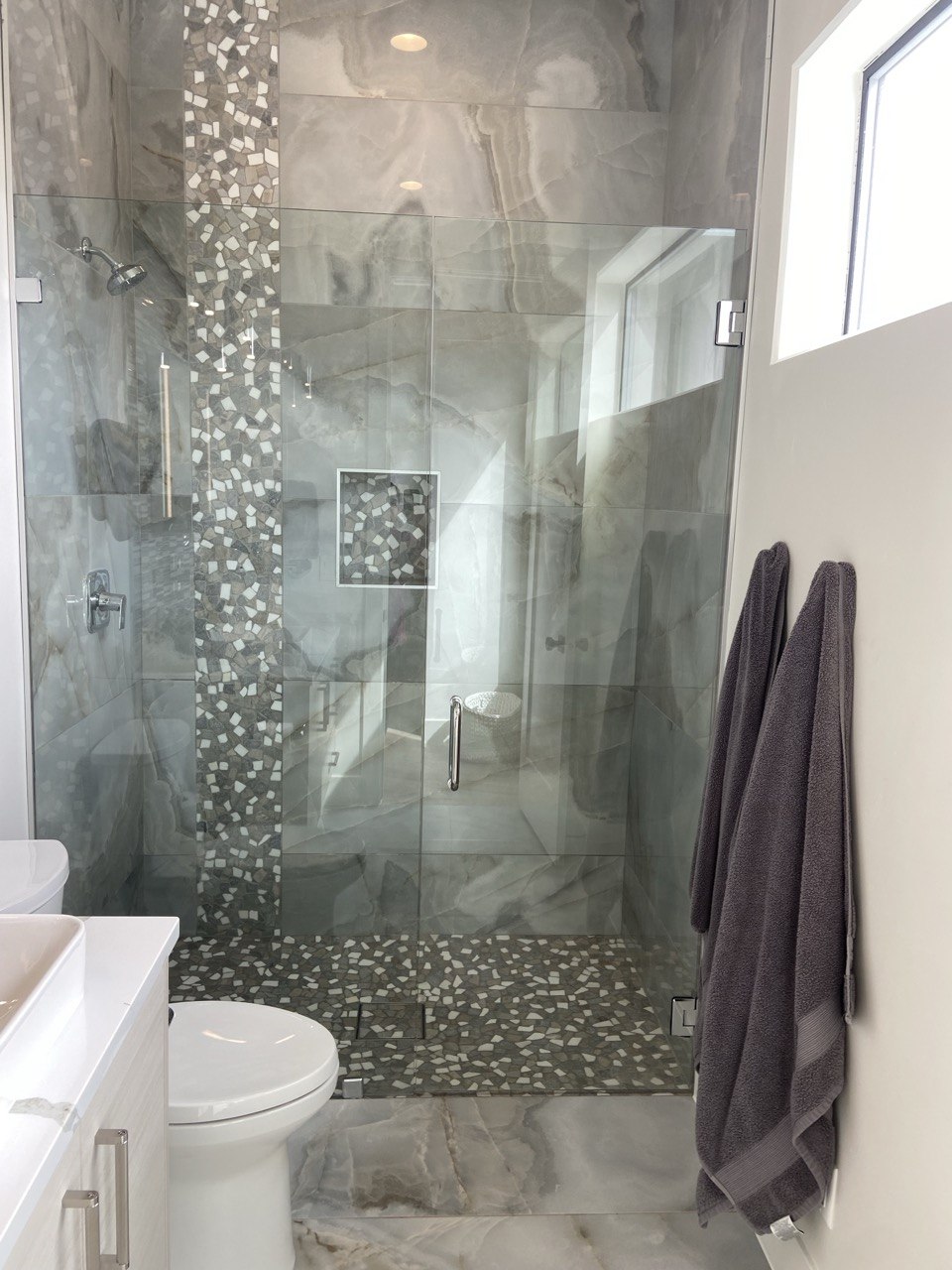 Beautiful marble glass shower cleaned to perfection